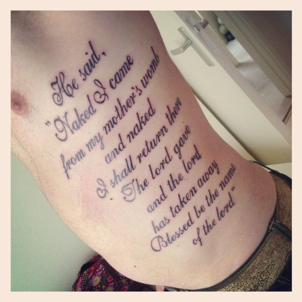 Cursive script tattoo of Job 1:21 on a person's side and hip.